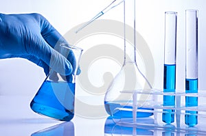 Laboratory scientist working at lab with test tubes