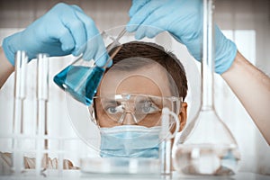 Laboratory scientist working at lab with test tubes