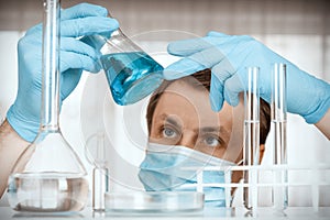 Laboratory scientist working at lab with test tubes