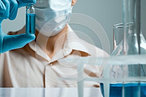 Laboratory scientist working at lab with test tubes