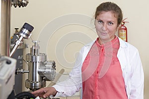Laboratory specialist examines the data obtained on a special apparatus for analyzing samples