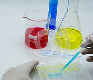 Laboratory technician conducts experiments, white background