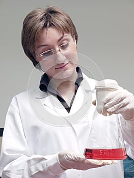 Laboratory technician with flask