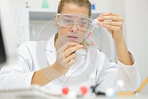 Laboratory technician with micro pipette