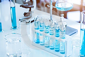 Laboratory test tubes and solution with stethoscope background. Science and Medical concept. Scientist research and analysis photo