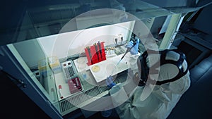 Laboratory unit with a researcher analyzing biochemical samples