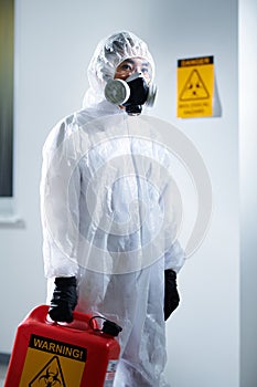 Laboratory worker in biohazard suit