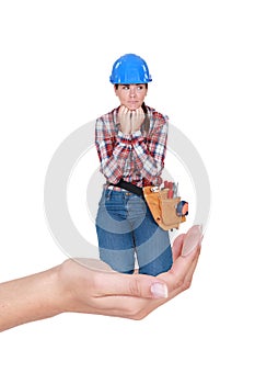 Laborer crouching in a hand