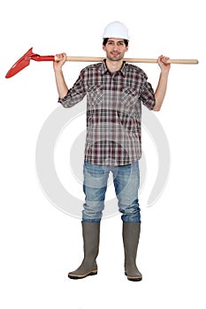 Laborer holding shovel