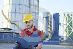 Laborer outside a factory working