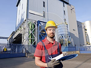 Laborer outside a factory working photo
