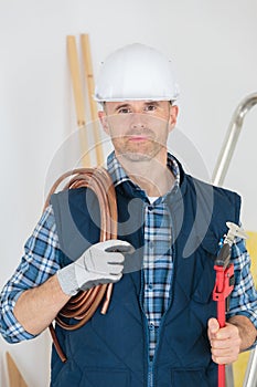 laborer posing with equipments