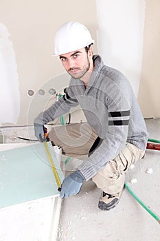 Laborer in room under construction