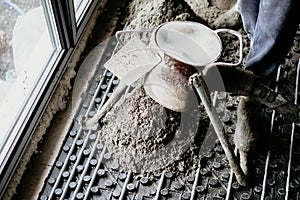 Laborer working on a floor screed with underfloor heating