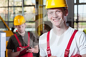 Laborers in overalls and hardhat