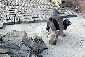 Laborers prepare bricks at a brick kiln in Sarberia, West Bengal, India