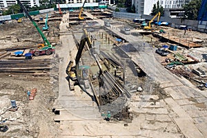 Laborers work at the construction site of a building.