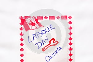 Labour day Canada handwriting on paper with Canada flag. Writing text on memo post reminder.Bucharest, Romania, 2020