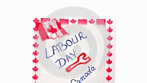 Labour day Canada handwriting on paper with Canada flag. Writing text on memo post reminder.Bucharest, Romania, 2020