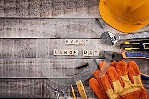 Labour Day, Wooden Block calendar with many handy tools on wooden background texture