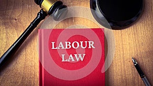 Labour and gavel on a table. Law and legal concept