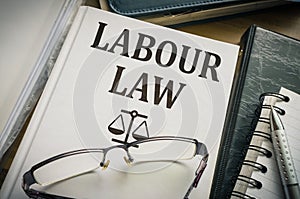 Labour or labor law book. Legislation and justice concept photo