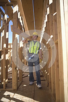 Labourer Carrying Plank Of Wood