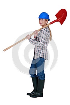 Labourer carrying a spade photo