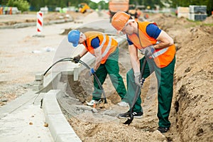 Labourers on a road construction photo