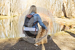 Labradoodle Dog and woman view from back outside at the park