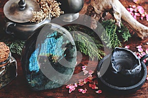 Labradorite crystal on wiccan witch altar photo