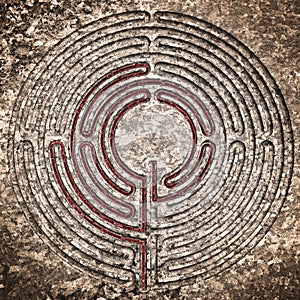 Labyrinth carved on stone - solution concept with path showing labyrinths end