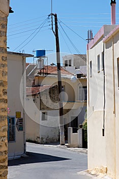Labyrinthine streets in Zarros with electricity pole