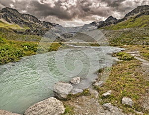 Lac de ChÃ¢teauprÃ© from Grimentz area wtih Moiry Glacier in background