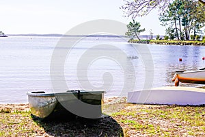 Lacanau Medoc water beach lake coast with boats on sand