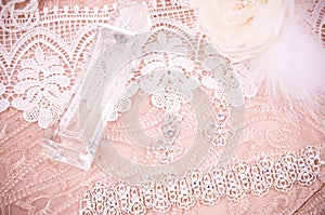 Lace with accessories, silver jewelry and perfume
