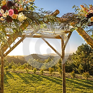 Lace cloth and flowers on a wooden Chuppah