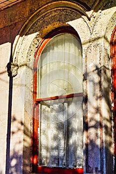 Lace Curtain in Old House Window