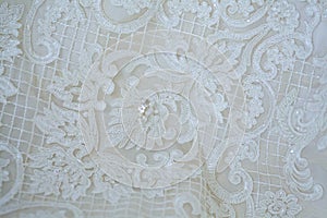 Lace and embroidery with beads on fabric