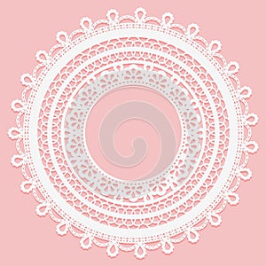 Lace frame on a pink background. Delicate round doily.