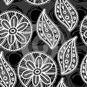 Lace seamless pattern with flowers and leaves on black background.