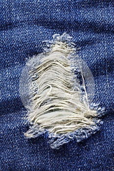 Laceration of jeans. photo