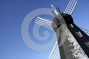 Lacey green windmill blue summer sky