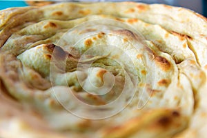 Lacha paratha, puff pastry. Traditional Indian flat bread paratha, close up