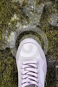 Lacing of light pink textile sneakers with. close-up
