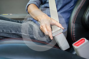 Lack a seat belt before driving a car, Closeup of man fastening seat belt in car, Safety belt safety first