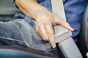 Lack a seat belt before driving a car, Closeup of man fastening seat belt in car, Safety belt safety first