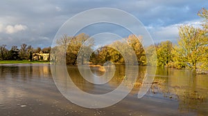 Lacock Abbey Wiltshire surrounded by flood water