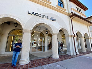 A Lacoste clothing retail store at an outdoor mall