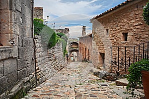 Lacoste, Vaucluse, Provence-Alpes-Cote d`Azur, France: ancient alley in the old town of the medieval village in the nature park o